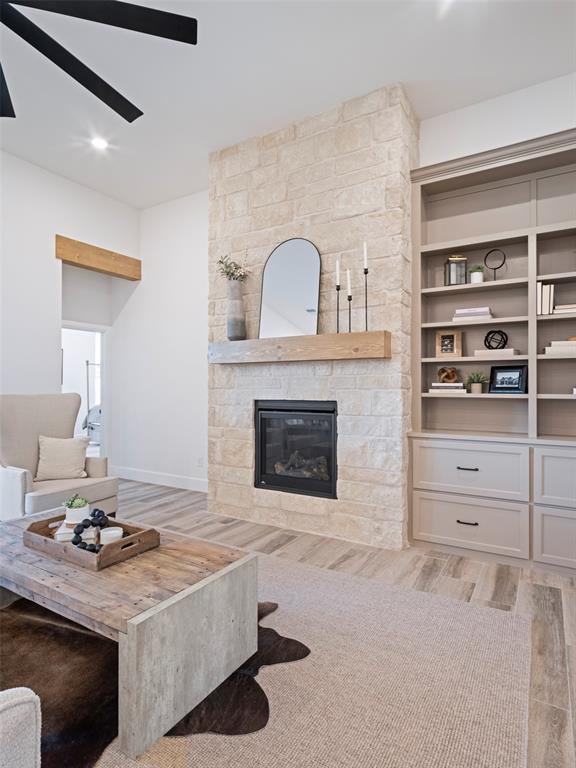 408 Nantucket Blvd, Norman, OK 73071 - living area featuring a fireplace and light wood-style flooring