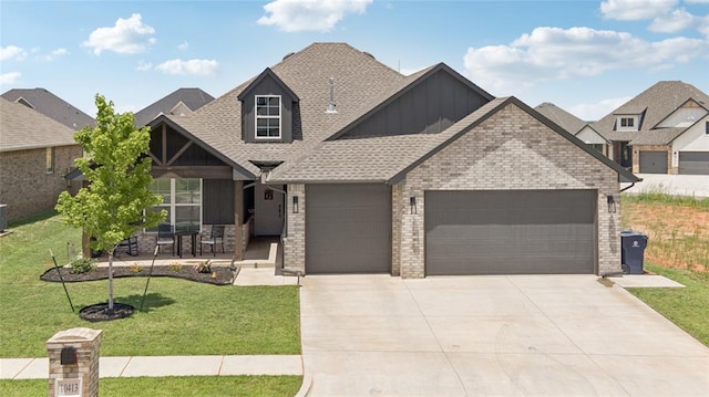 10413 SW 51st St, Mustang, OK 73064 - craftsman inspired home featuring a garage, board and batten siding, driveway, a front lawn, and roof with shingles