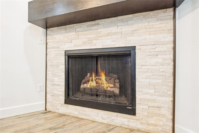 10413 SW 51st St, Mustang, OK 73064 - detailed view of a fireplace and wood finished floors
