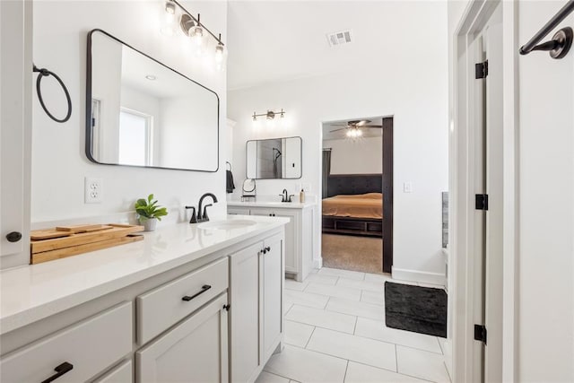 10413 SW 51st St, Mustang, OK 73064 - full bathroom featuring vanity, ceiling fan, ensuite bathroom, and tile patterned floors