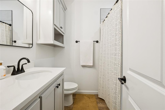 10413 SW 51st St, Mustang, OK 73064 - bathroom featuring vanity and wood finished floors