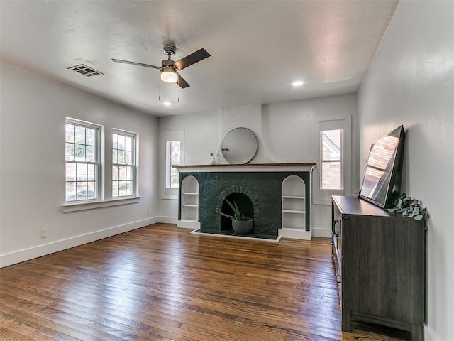 2016 Hardin Dr, Oklahoma City, OK 73111 - unfurnished living room with a ceiling fan, wood finished floors, and a fireplace