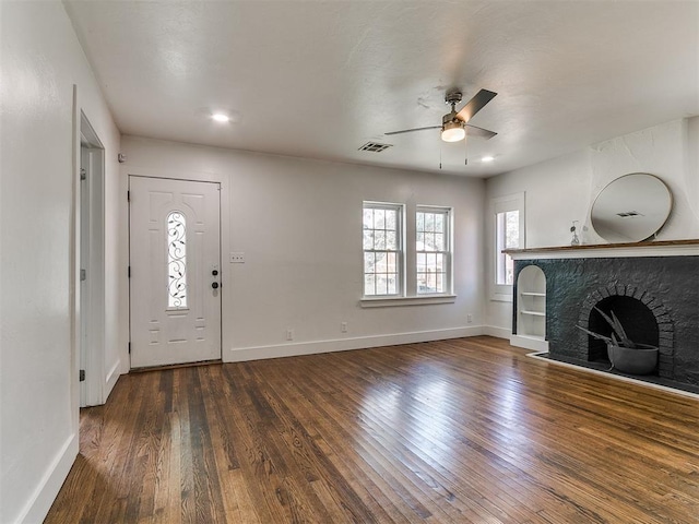 2016 Hardin Dr, Oklahoma City, OK 73111 - unfurnished living room with a ceiling fan, wood-type flooring, and a fireplace