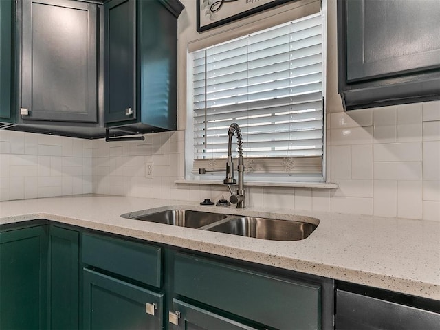 2016 Hardin Dr, Oklahoma City, OK 73111 - kitchen with green cabinets, decorative backsplash, and light stone countertops