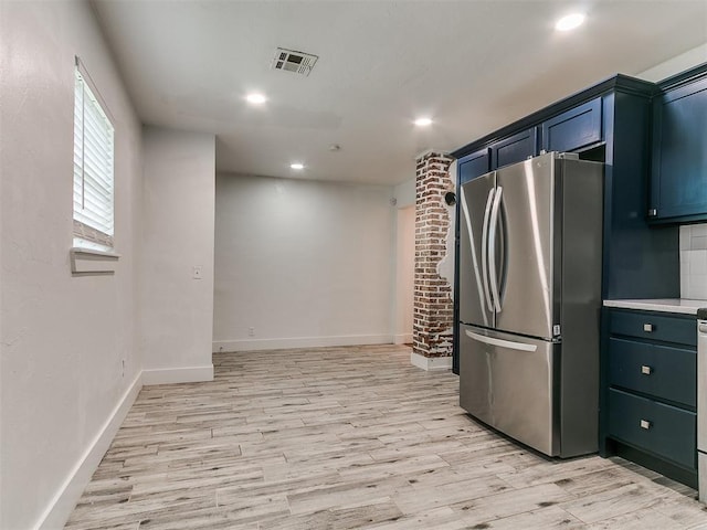 2016 Hardin Dr, Oklahoma City, OK 73111 - kitchen with freestanding refrigerator, light wood-style floors, light countertops, and recessed lighting