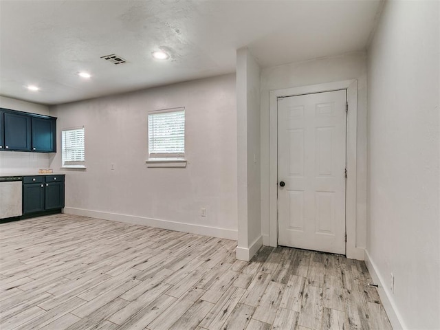 2016 Hardin Dr, Oklahoma City, OK 73111 - kitchen with stainless steel dishwasher, light wood-style flooring, light countertops, and recessed lighting