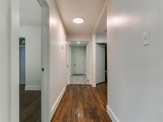 2016 Hardin Dr, Oklahoma City, OK 73111 - corridor featuring dark wood finished floors and baseboards