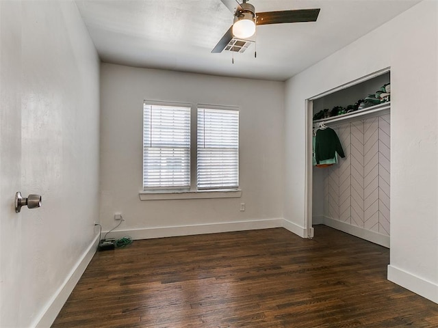 2016 Hardin Dr, Oklahoma City, OK 73111 - unfurnished bedroom featuring dark wood finished floors, a ceiling fan, and a closet