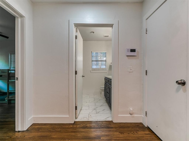 2016 Hardin Dr, Oklahoma City, OK 73111 - hallway featuring baseboards and wood finished floors