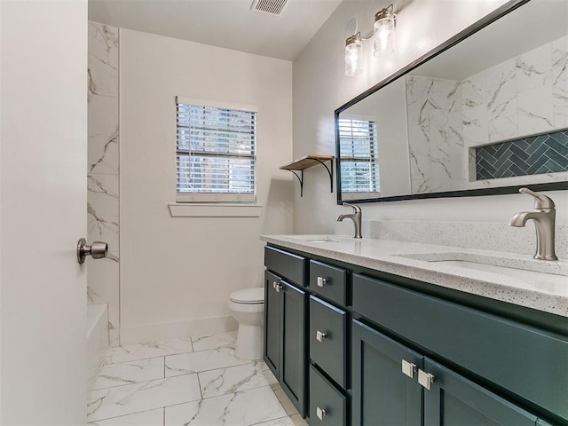 2016 Hardin Dr, Oklahoma City, OK 73111 - bathroom with double vanity, marble finish flooring, and shower / tub combination