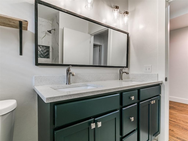 2016 Hardin Dr, Oklahoma City, OK 73111 - bathroom with double vanity, wood finished floors, and a shower