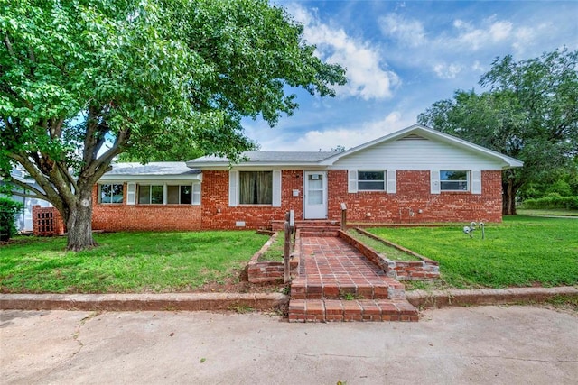 420 E 12th St, Chandler, OK 74834 - single story home featuring brick siding and a front yard