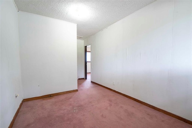 420 E 12th St, Chandler, OK 74834 - carpeted empty room featuring a textured ceiling and baseboards