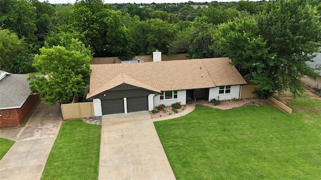 5104 N Everest Ave, Oklahoma City, OK 73111 - ranch-style home featuring an attached garage, concrete driveway, roof with shingles, and a chimney
