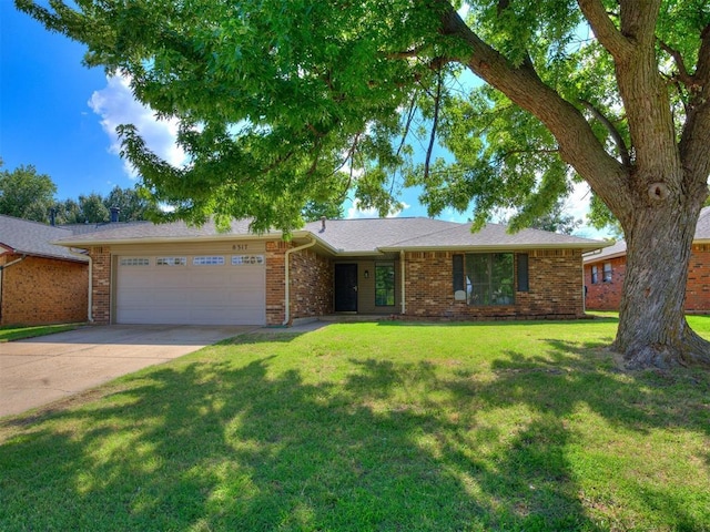 8317 Curtis Ter, Oklahoma City, OK 73132 - ranch-style house featuring an attached garage, driveway, brick siding, and a front yard