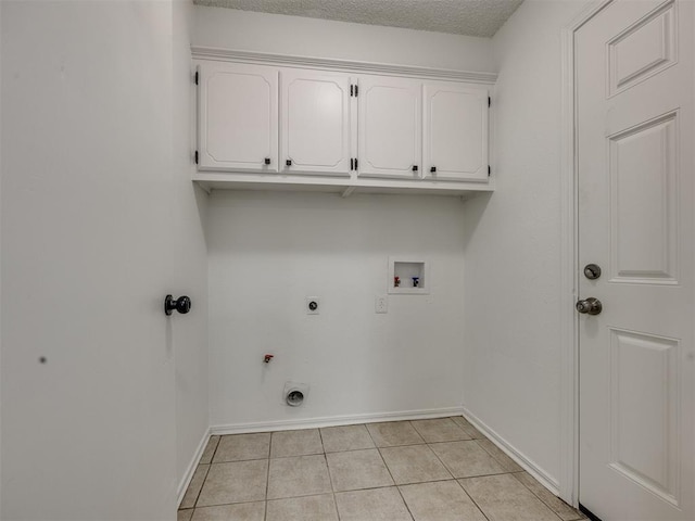 8317 Curtis Ter, Oklahoma City, OK 73132 - laundry room featuring cabinet space, hookup for an electric dryer, washer hookup, light tile patterned floors, and gas dryer hookup