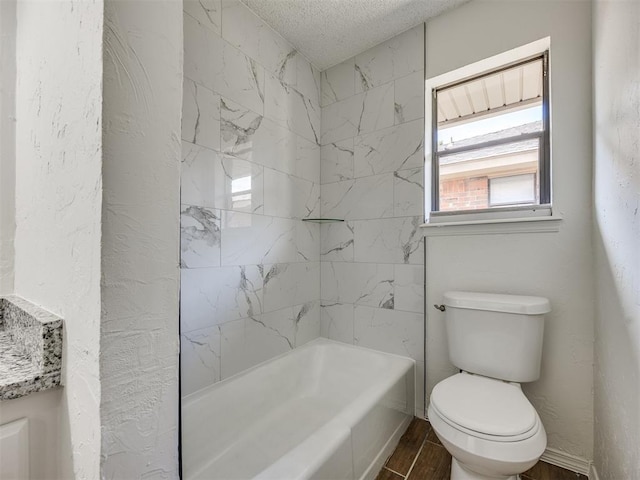 8317 Curtis Ter, Oklahoma City, OK 73132 - bathroom featuring a textured ceiling, wood finished floors, and shower / tub combination