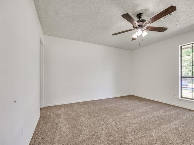8317 Curtis Ter, Oklahoma City, OK 73132 - carpeted spare room with a textured ceiling and a ceiling fan