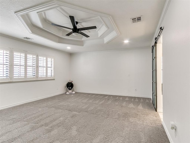 620 SW 113th St, Oklahoma City, OK 73170 - unfurnished room featuring a ceiling fan, carpet floors, ornamental molding, a barn door, and a tray ceiling