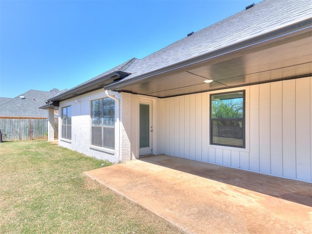 620 SW 113th St, Oklahoma City, OK 73170 - rear view of house with a patio area and roof with shingles