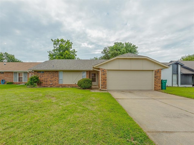 10428 Fairfax Ln, Yukon, OK 73099 - view of front of home with brick siding, a garage, concrete driveway, and a front lawn