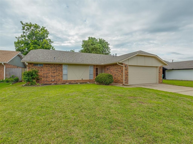 10428 Fairfax Ln, Yukon, OK 73099 - single story home featuring brick siding, a garage, driveway, and roof with shingles