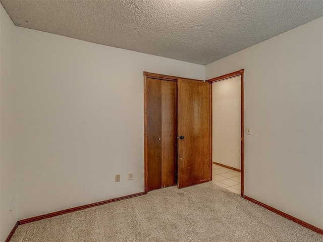 10428 Fairfax Ln, Yukon, OK 73099 - empty room featuring carpet and a textured ceiling
