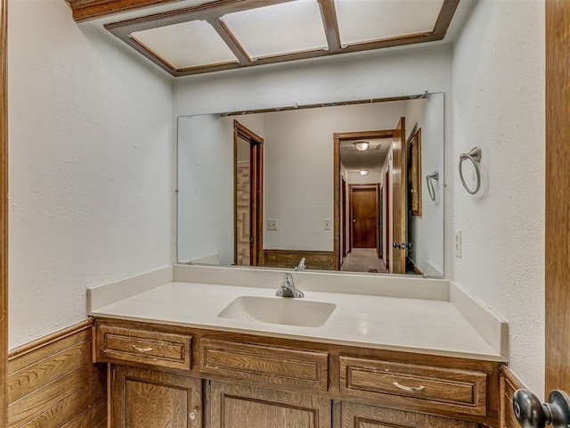 10428 Fairfax Ln, Yukon, OK 73099 - bathroom featuring vanity and a textured wall
