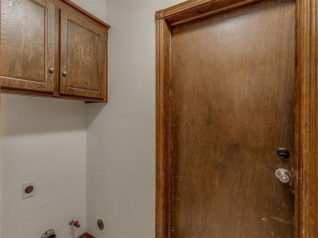 10428 Fairfax Ln, Yukon, OK 73099 - washroom with hookup for an electric dryer, gas dryer hookup, and cabinet space