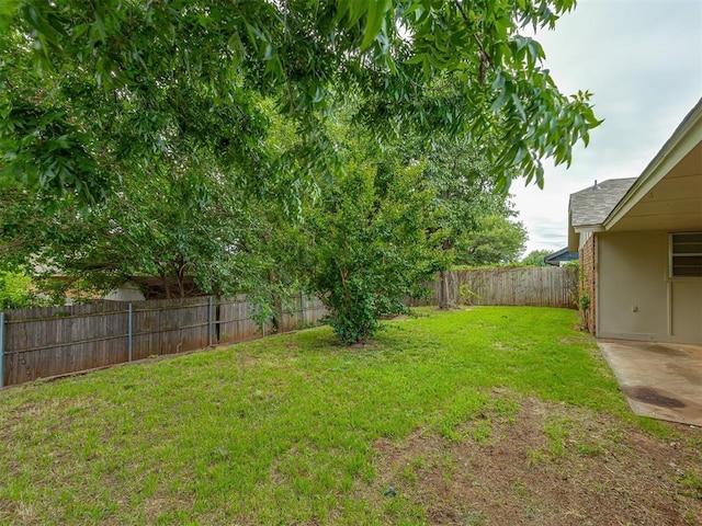 10428 Fairfax Ln, Yukon, OK 73099 - fenced backyard with a patio