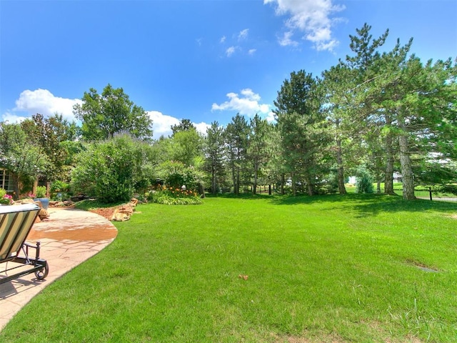 5708 Normandy Ter, Oklahoma City, OK 73142 - view of grassy yard with a patio