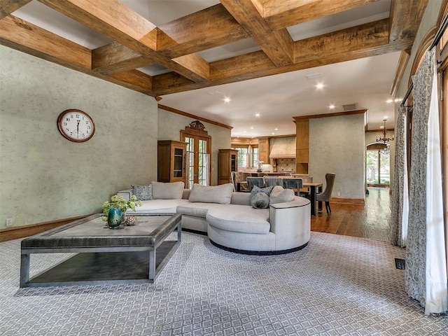 5708 Normandy Ter, Oklahoma City, OK 73142 - living area featuring healthy amount of natural light, wood finished floors, coffered ceiling, beam ceiling, and recessed lighting