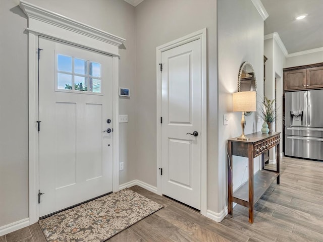 18716 Lazy Grove Dr, Edmond, OK 73012 - foyer entrance featuring ornamental molding, light wood-type flooring, and recessed lighting