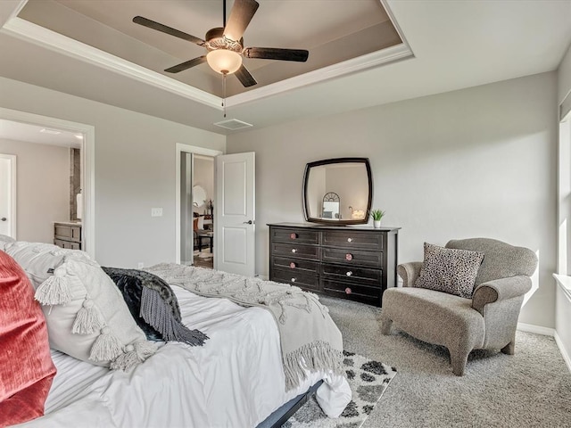 18716 Lazy Grove Dr, Edmond, OK 73012 - bedroom featuring a tray ceiling, carpet flooring, and ceiling fan
