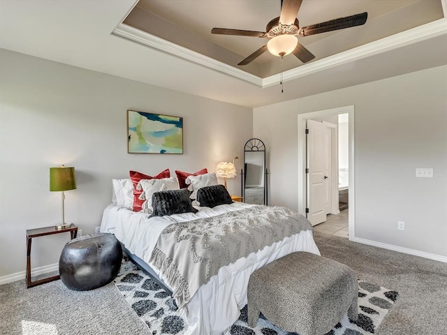 18716 Lazy Grove Dr, Edmond, OK 73012 - bedroom with a tray ceiling, light colored carpet, ceiling fan, and connected bathroom