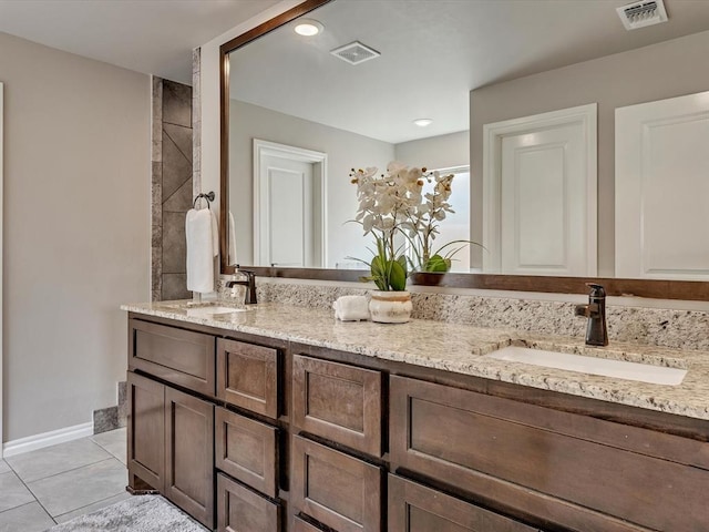 18716 Lazy Grove Dr, Edmond, OK 73012 - bathroom featuring double vanity, tile patterned flooring, and recessed lighting
