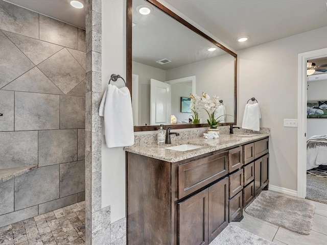 18716 Lazy Grove Dr, Edmond, OK 73012 - full bathroom with double vanity, a walk in shower, recessed lighting, and ceiling fan