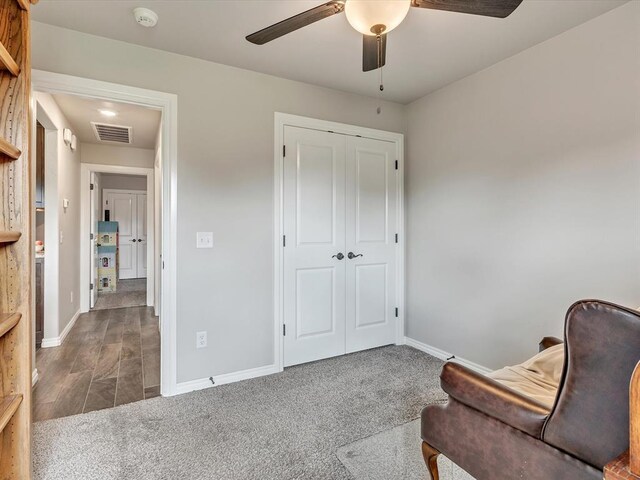 18716 Lazy Grove Dr, Edmond, OK 73012 - sitting room with ceiling fan and carpet flooring