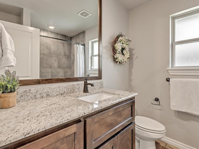 18716 Lazy Grove Dr, Edmond, OK 73012 - full bathroom featuring vanity, tiled shower, and tile patterned flooring