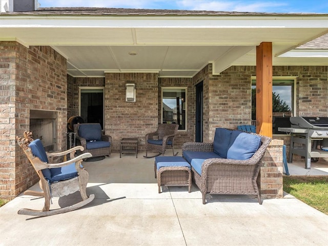 18716 Lazy Grove Dr, Edmond, OK 73012 - view of patio / terrace featuring an outdoor living space with a fireplace and area for grilling