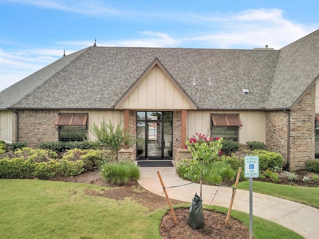 18716 Lazy Grove Dr, Edmond, OK 73012 - view of front of home with brick siding and roof with shingles