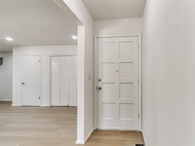 502 Walnut Ave, Yukon, OK 73099 - foyer entrance with light wood-type flooring and a textured ceiling