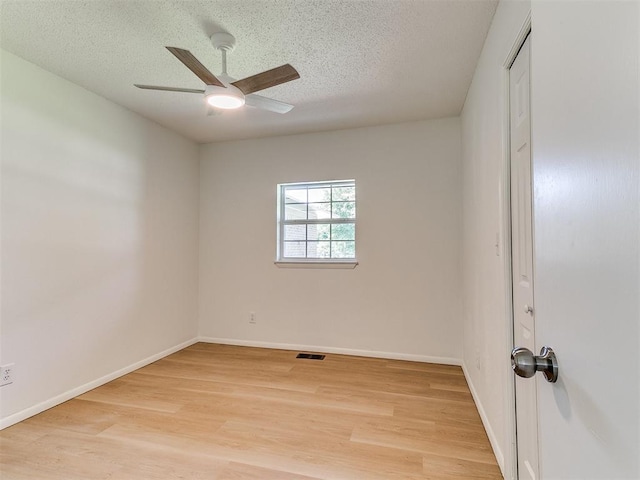 502 Walnut Ave, Yukon, OK 73099 - empty room with light wood-style flooring, a ceiling fan, and a textured ceiling