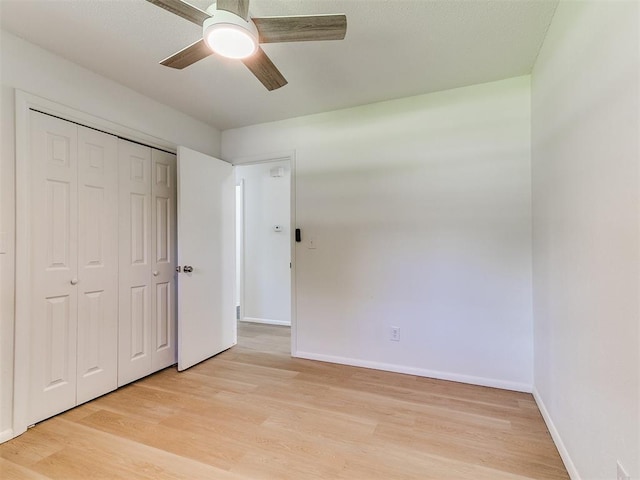 502 Walnut Ave, Yukon, OK 73099 - unfurnished bedroom with light wood-style floors, a closet, and a ceiling fan