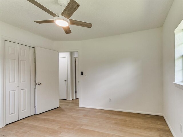 502 Walnut Ave, Yukon, OK 73099 - unfurnished bedroom featuring light wood-type flooring, a closet, and ceiling fan