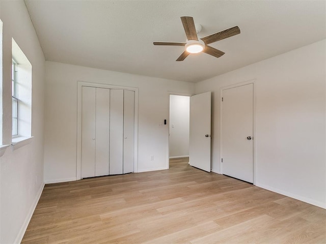 502 Walnut Ave, Yukon, OK 73099 - unfurnished bedroom featuring light wood-type flooring and ceiling fan