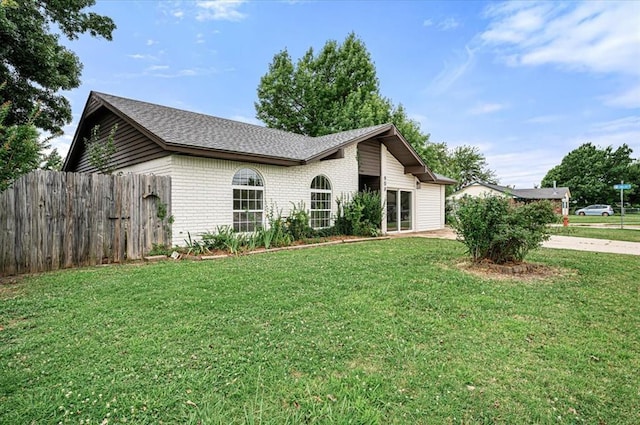908 NW 12th St, Moore, OK 73160 - ranch-style house with brick siding, concrete driveway, and roof with shingles