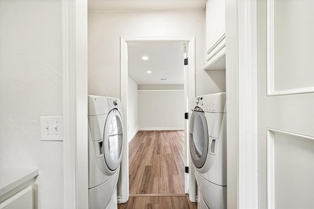 908 NW 12th St, Moore, OK 73160 - washroom featuring washer / clothes dryer and light wood finished floors