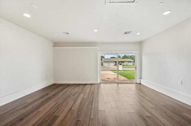 908 NW 12th St, Moore, OK 73160 - unfurnished room with wood finished floors and recessed lighting