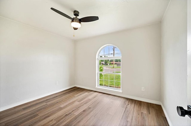 908 NW 12th St, Moore, OK 73160 - unfurnished room with wood finished floors and a ceiling fan